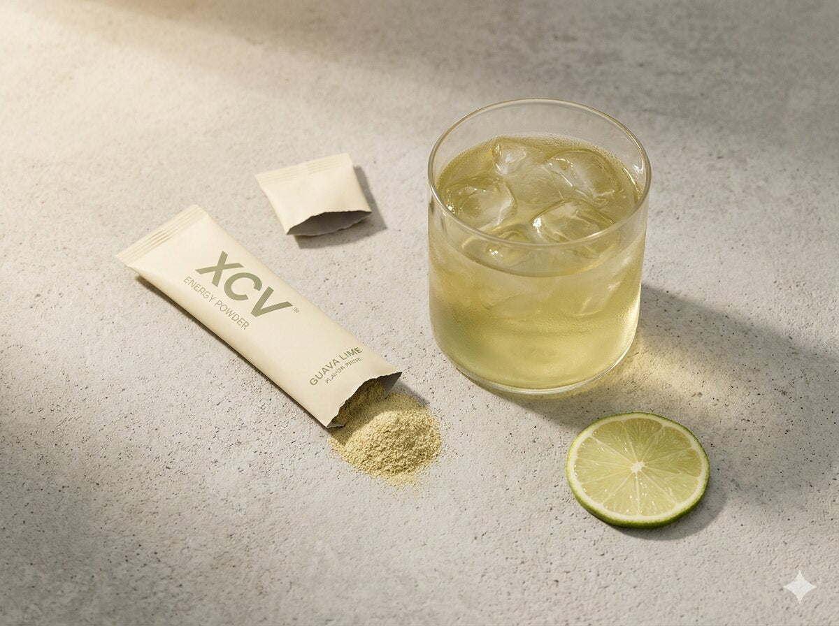 XCV stick pack torn open with mixed drink and lime